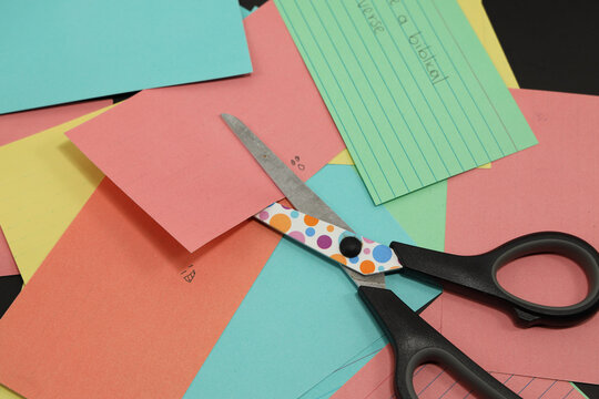 school scissors cutting colored paper