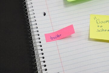 sticky notes stuck to a school notebook written on them student teacher school homework