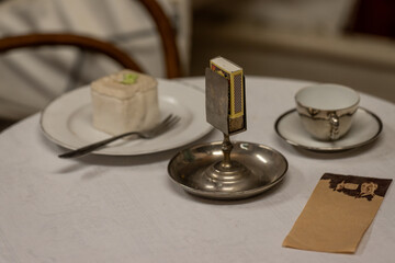 A detail of a metal match holder.
