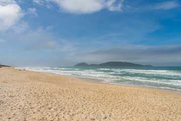 Fototapeta premium A view of Campeche beach and Campeche island in the background - Florianopolis, Brazil