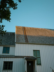 Rusty old ladder on a roof of a church with stone roof tiles in Melbu Norway