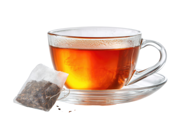 A clear glass teacup filled with steaming dark brown tea, accompanied by a small tea bag with visible brown tea leaves