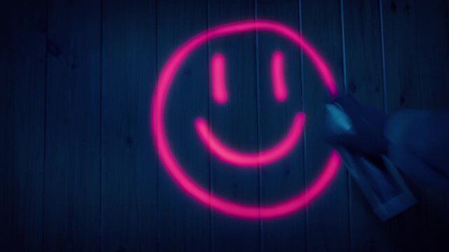 Neon Pink Graffiti Character Is Sprayed At Night
