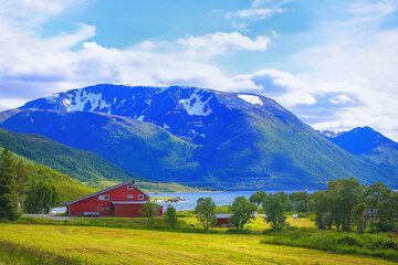 Houses on the shore of Gullesfjord on Hinnoya Island, Vesteralen archipelago, Northern Norway.