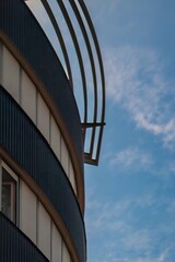 Architectural Detail Framed by Blue Sky and Clouds