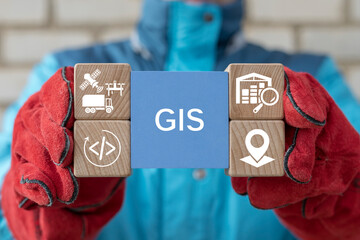 Engineer holding blocks with icons sees the acronym GIS. GIS Geographic Information System Modern Industry 4.0 Software Database Transportation Tracking Concept.