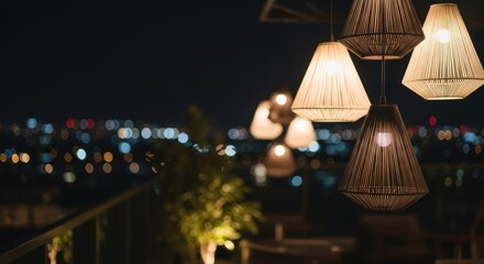 Warm glow of pendant lights against a blurred cityscape at night