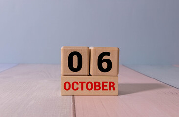 Wooden calendar with the date October 6. Monthly calendar