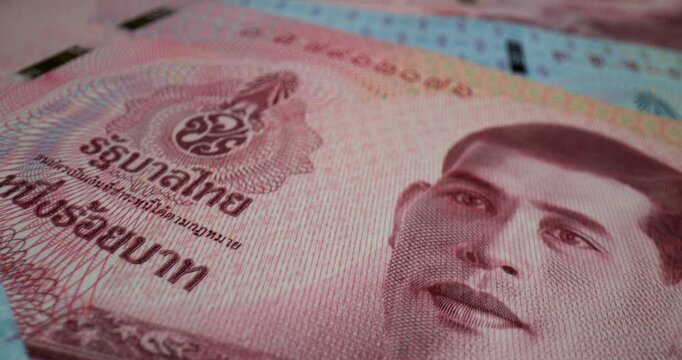 Currency details showcasing intricate designs and patterns of banknotes used in everyday transactions in a market setting