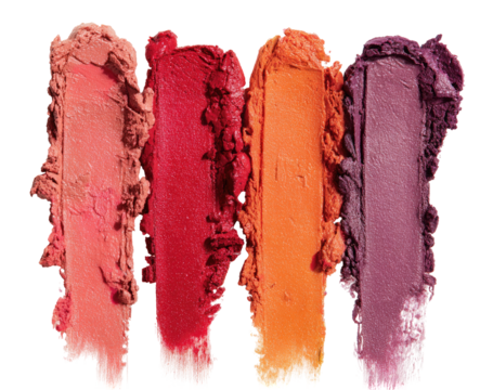 Close-up of four swatches of lipstick, various shades of warm tones, from light peach to deep plum, smudged and textured