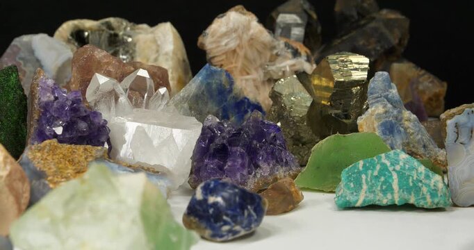 Semi Precious stones and minerals. Purple Amethysts, Quartz crystals, blue Lazurite, Agate, Green garnet or Uvarovite, green Nephrite and Amazon stone, Citrine, Barite, blue Kyanite and golden Pyrite