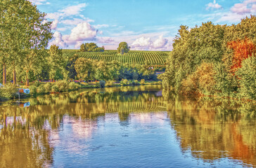 Fototapeta premium Serene Autumn River with Hills and Sky