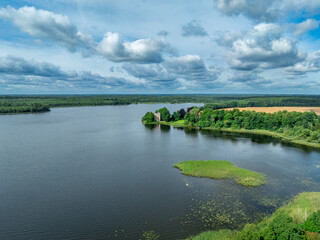 Aerial view of Bergkvara castle and lake in Sweden near Vaxj&ouml;. Abandoned square shape medieval ruin