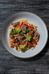 Top view of pasta with beef and broccoli. 