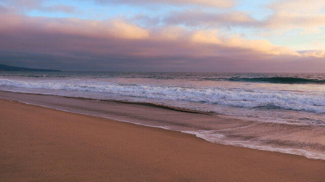California beach at sunset with sand and ocean - Powered by Adobe