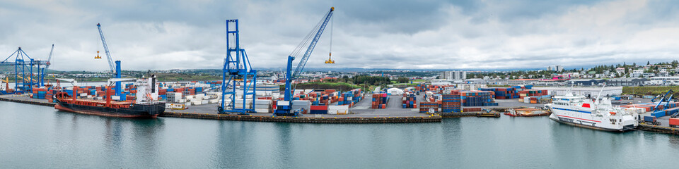 Commercial cargo port of Reykjavik Iceland under cloudy skies.