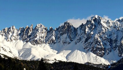Majestic snow-capped mountains under a clear sky