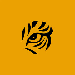 Tiger eye logo design, stylized tiger eye in a circle, black and yellow background.