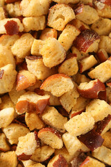 Dry baked small pieces of bread sprinkled with paprika,delicious snack