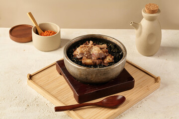 A bowl made of stone filled with seaweed and beef rice,Korean Bibimbap