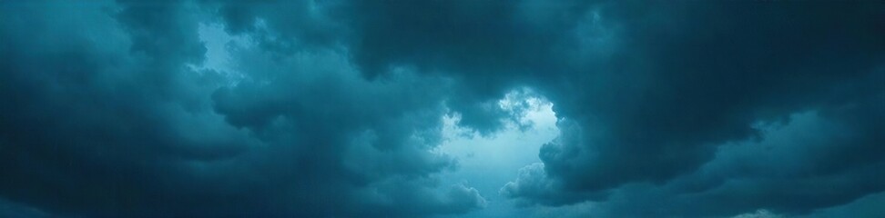 Obraz premium Dark and dramatic stormy skies overhead, heavy clouds filled with rain, ominous and powerful Perfect for weather, nature, and atmospheric imagery , cloudscape, moody, sky texture
