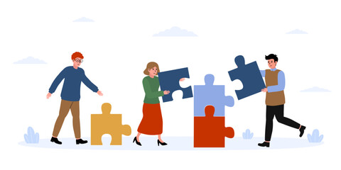 People collaborating to assemble a large colorful puzzle outdoors on a sunny day