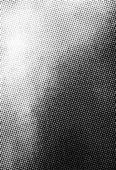 Abstract halftone gradient texture with black dots on white background, perfect for retro comics, vintage posters, print design, and backgrounds.