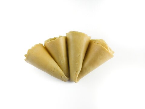Semprong cake, sapit, sepit, Dutch cake, gapit, kassipi, kapit, Asian egg roll. A waffle or pastry snack originating from Indonesia. Semprong cake isolated on a white background.