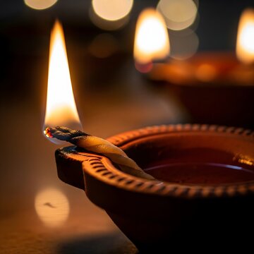 Traditional Clay Diya with Flame for Diwali Festival Lighting Decor