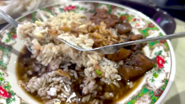 Authentic Rawon, a traditional Indonesian beef soup from East Java, served with rice, bean sprouts, and salted egg. A rich and flavorful culinary experience.