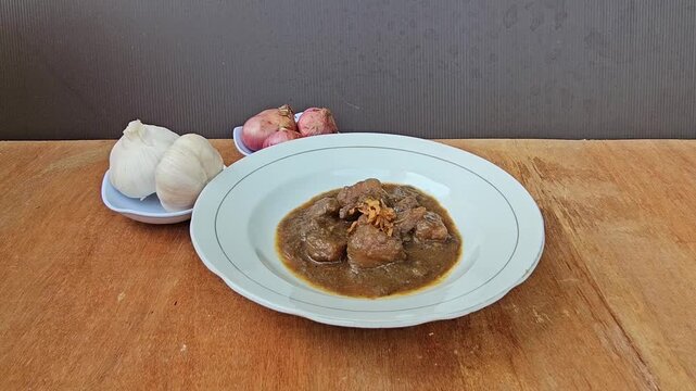 cup of coffee,Semur daging is an Indonesian meat stew in thick brown gravy,served with steamed rice