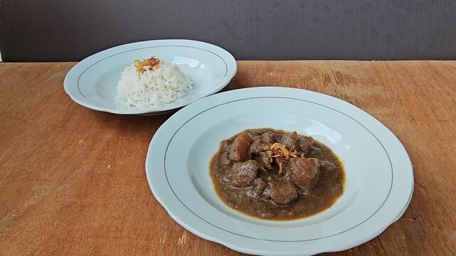 chocolate cake with nuts,Semur daging is an Indonesian meat stew in thick brown gravy,served with steamed rice