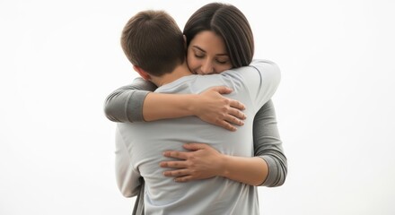 Fototapeta premium Intimate embrace of a woman hugging a man on a plain background conveying affection and support