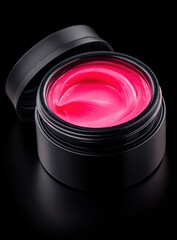 A black jar sits open revealing vibrant, swirled pink contents against a stark black background, creating high contrast and a minimalist aesthetic