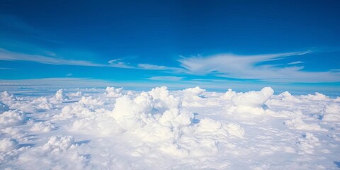 Vast, breathtaking panorama of fluffy clouds beneath a vibrant blue sky,  sky,  horizon