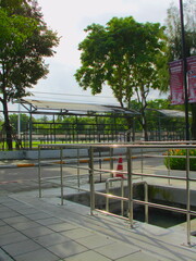 Outdoor ramp surrounded by trees and urban garden details, styled in vintage retro tones.