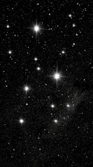 Sparse star field reveals bright, clustered stars against a deep black cosmic background, suggesting constellations in the night sky