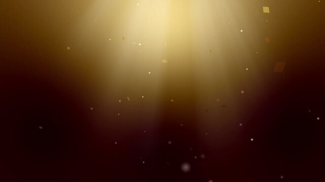 光のライトの中、紙吹雪とキラキラが舞うループ動画　ゴールド背景