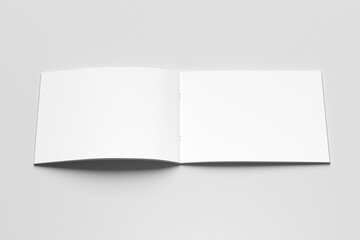 Landscape blank mockup of an open book, magazine, brochure or booklet isolated on a light grey background