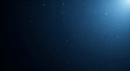 Enigmatic dust particles float softly in a dimly lit, deep blue void ambiance