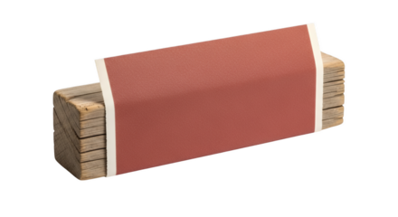 Wood Blocks Banded with Paper: A stack of weathered wood blocks is tightly banded with a rustic brown paper, showcasing the beauty of raw materials and simplicity.