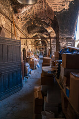 Historic Ottoman caravanserai inn courtyard with stone arches and workshops in Istanbul Turkey showing traditional architecture and cultural heritage site