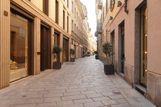 Via della Spiga in the historic center of Milan, the fashion district, the fashion quadrilateral, on a summer morning of an August Sunday, with the city still half empty due to the summer holidays.