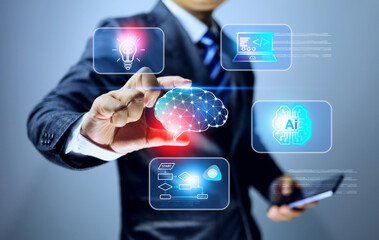 Research and development concept with businessman holding a brain icon representing R and D to finding new innovation and technology and using AI to help in work process