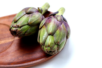 Fototapeta premium Fresh artichokes with green-purple tones