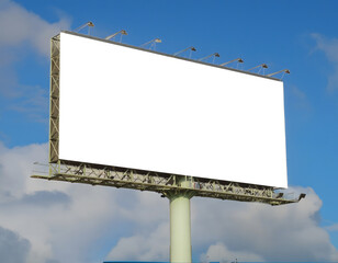 Obraz premium Large blank white billboard against a bright blue sky with scattered clouds, ready for advertising content.