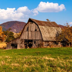 Obraz premium Rustic barn in autumn landscape