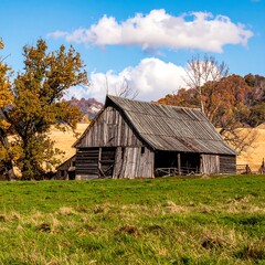 Obraz premium Rustic barn in autumnal landscape
