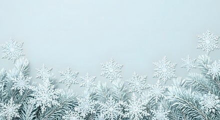 Obraz premium Elegant winter background with silver snowflakes and frosted branches, creating a serene and festive atmosphere for holiday greetings and seasonal designs