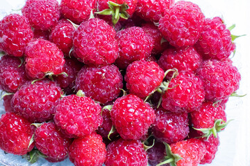 Raspberry. Juicy raspberries close-up. The taste of summer. Summer mood.